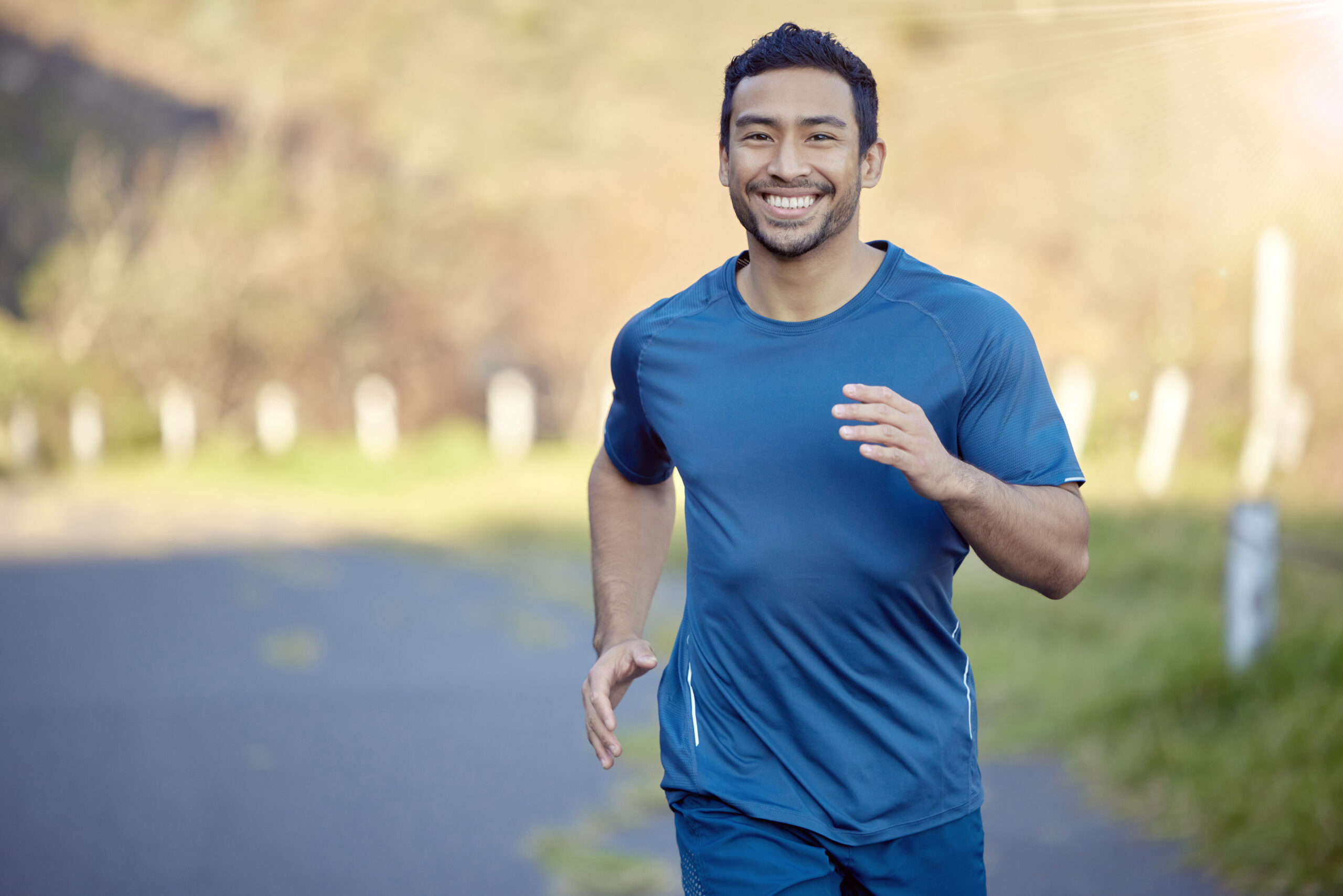 Man smiling and taking a run