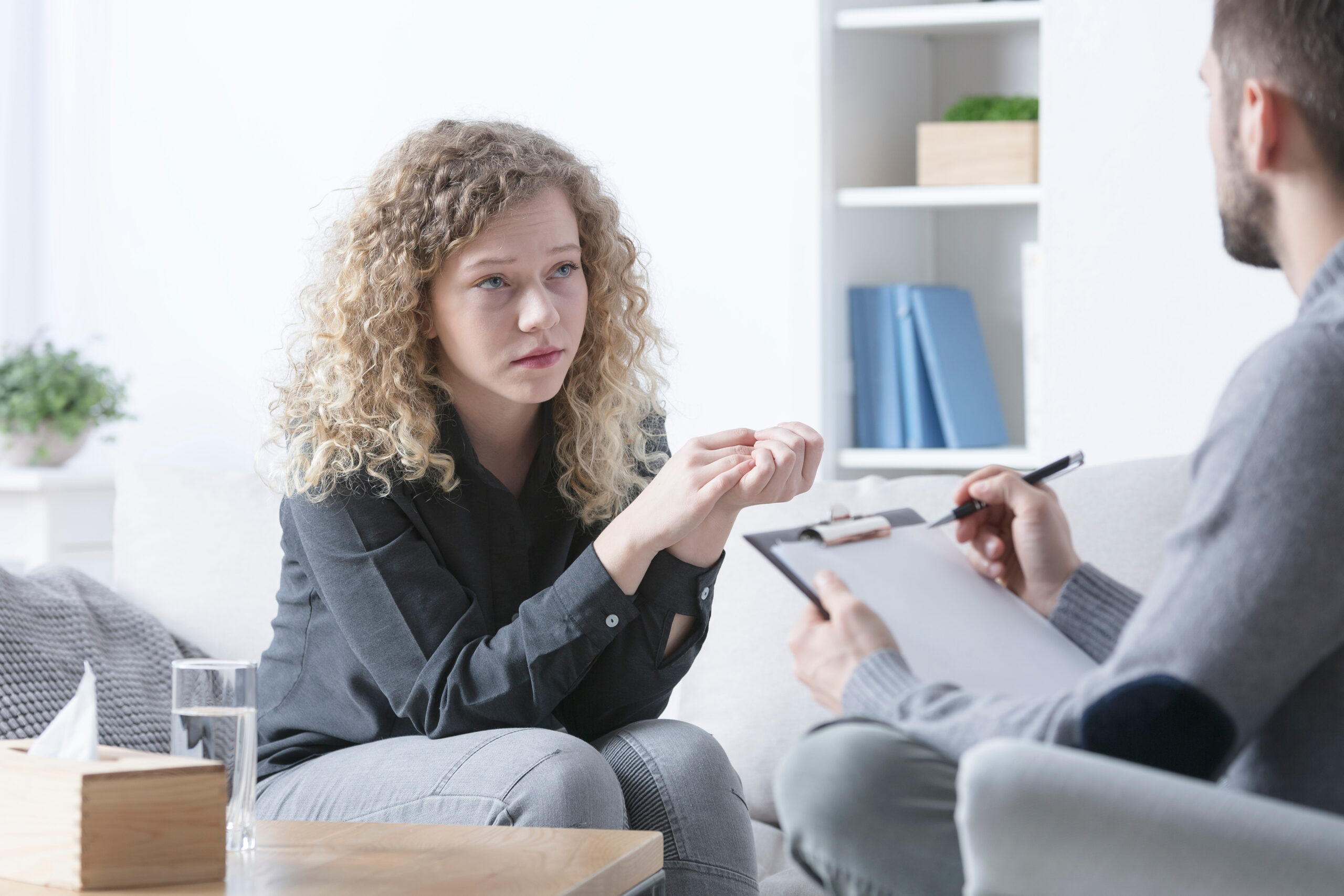 Young woman attending therapy after struggling with OCD