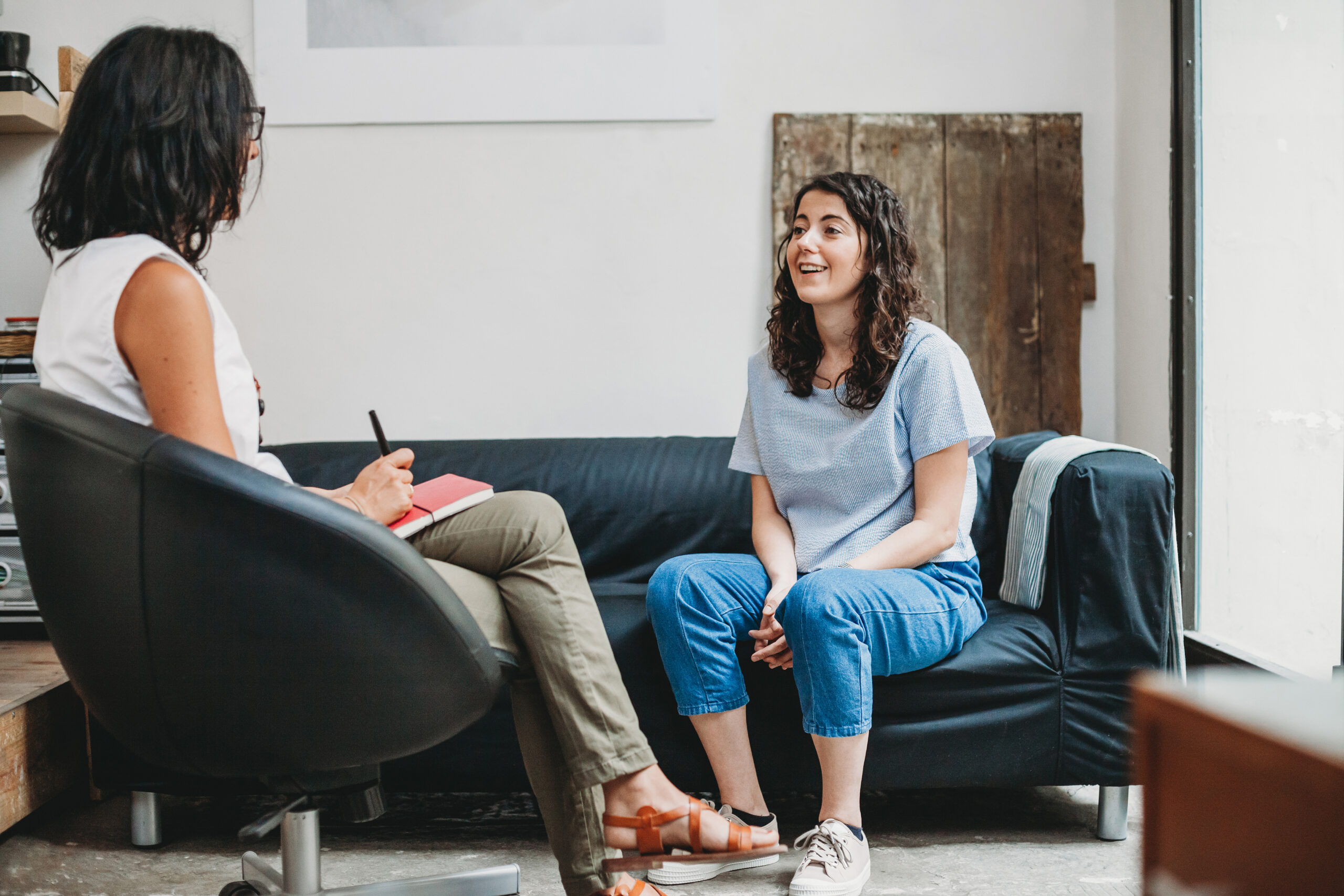 Woman who struggled with ADHD burnout talking to her therapist