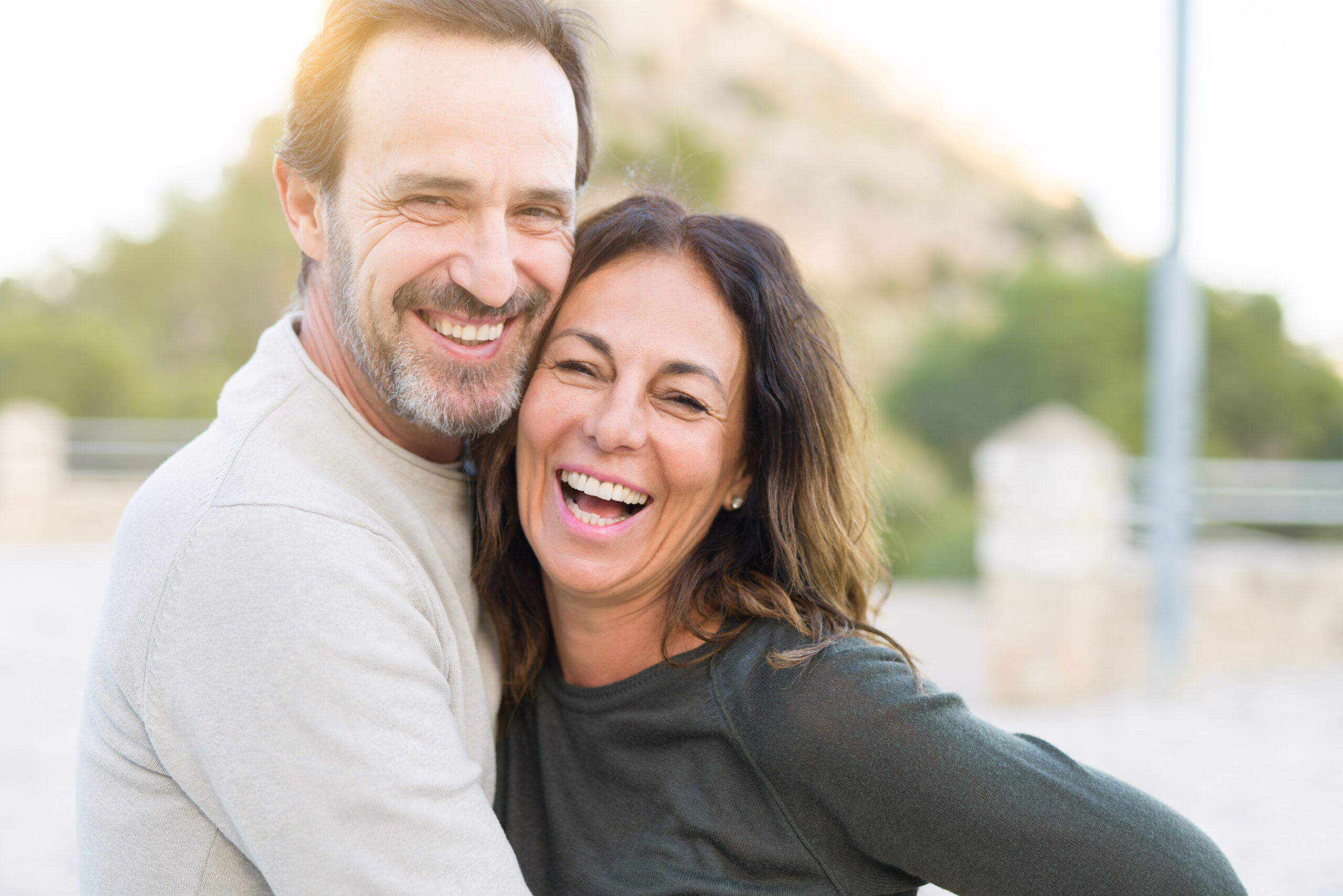 Happy couple hugging and smiling