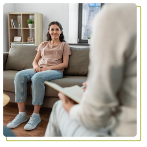 Health Sense happy smiling young woman patient and woman psychologist at psychotherapy session