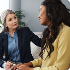 compassionate therapist discusses why therapy feels hard with client in a session