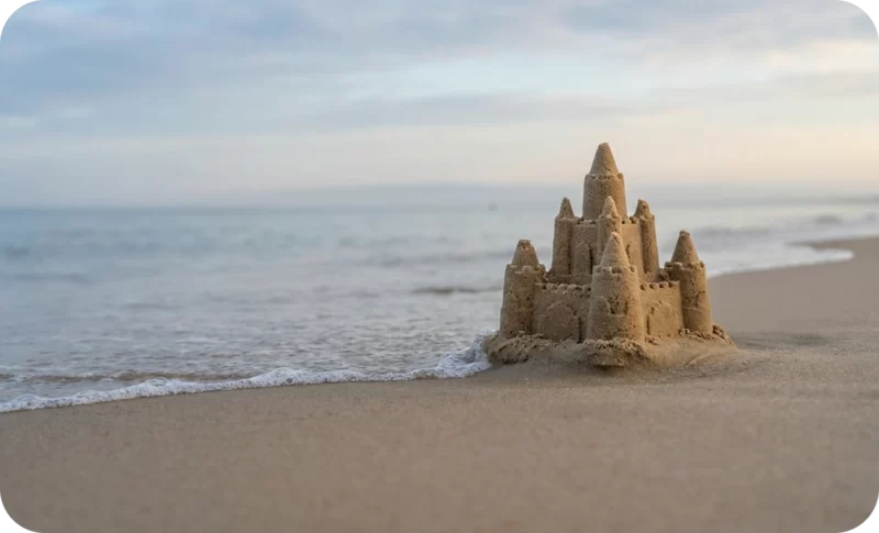 Falling for a Partner’s Potential: Red Flags, Risks & Reality Checks 2 Sandcastle by the bridge. The building of the sandcastle represents potential that can be built, and this represents a partner's potential that can be traced back to a strong foundation.