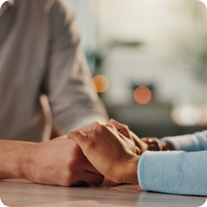 A couple holding hands for perimenopause and marriage support