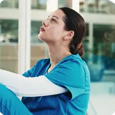 Featured image showing a worker reflecting on workplace grief after a stressful job