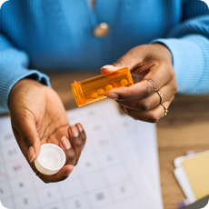 Close-up of medication and calendar for chronic illness mental health article