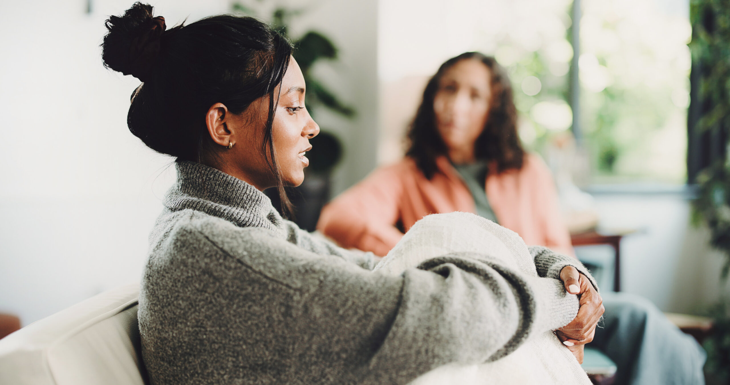 Healing After Suffering: How to Find Yourself After Loss or Trauma 1 A person speaking with a therapist, representing healing after suffering with compassionate support.