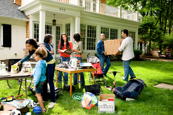 A suburban family holds a yard sale to get rid of clutter.