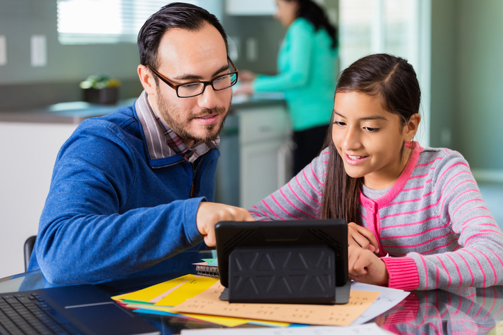 A father gets involved in his daughter's homework.