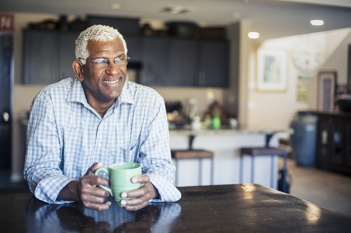 Elderly man drinking coffee