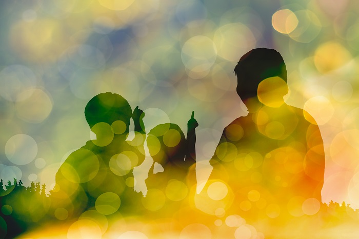 Silhouettes of a family in the evening