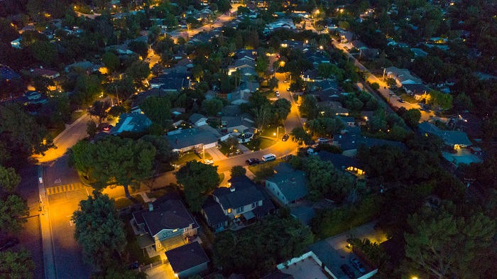 Aerial view of lit up neighborhood at night