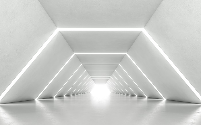 Well-lit, bare, white tunnel