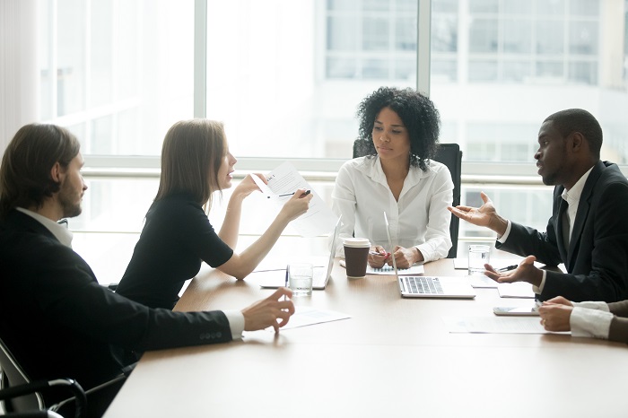 People arguing during a meeting at work