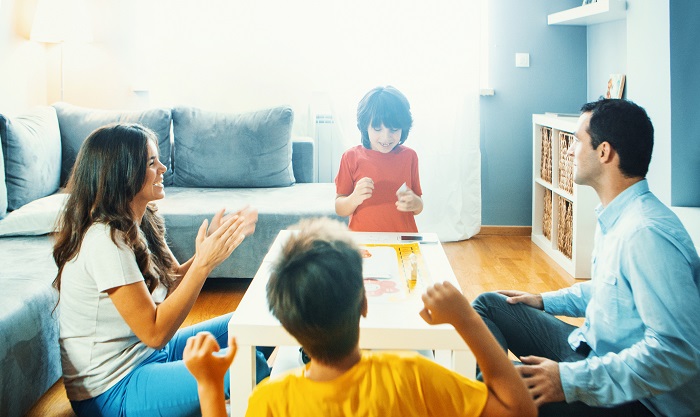 Children and teens playing a family game