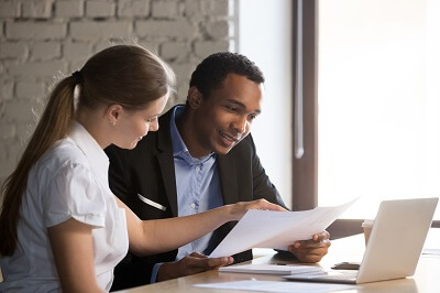 Professionals looking at insurance document