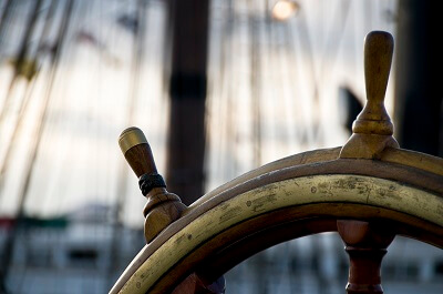 Closeup of captain's wheel on a ship