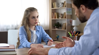 Girl talking with school counselor