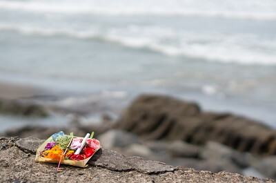 Religious offering on cliff side in Bali