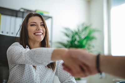 Therapist shaking client's hand