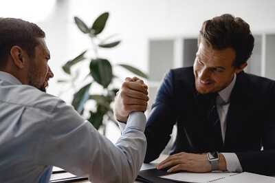 Two mental health professionals arm wrestling 