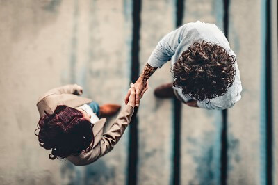 Bird's eye view of two people shaking hands