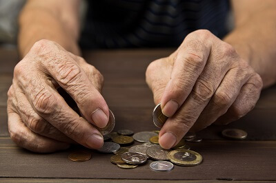 Hands holding some coins