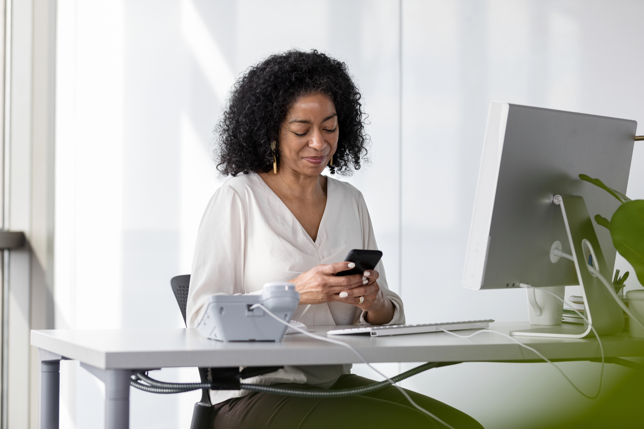 Mental health professional managing her practice from her phone.