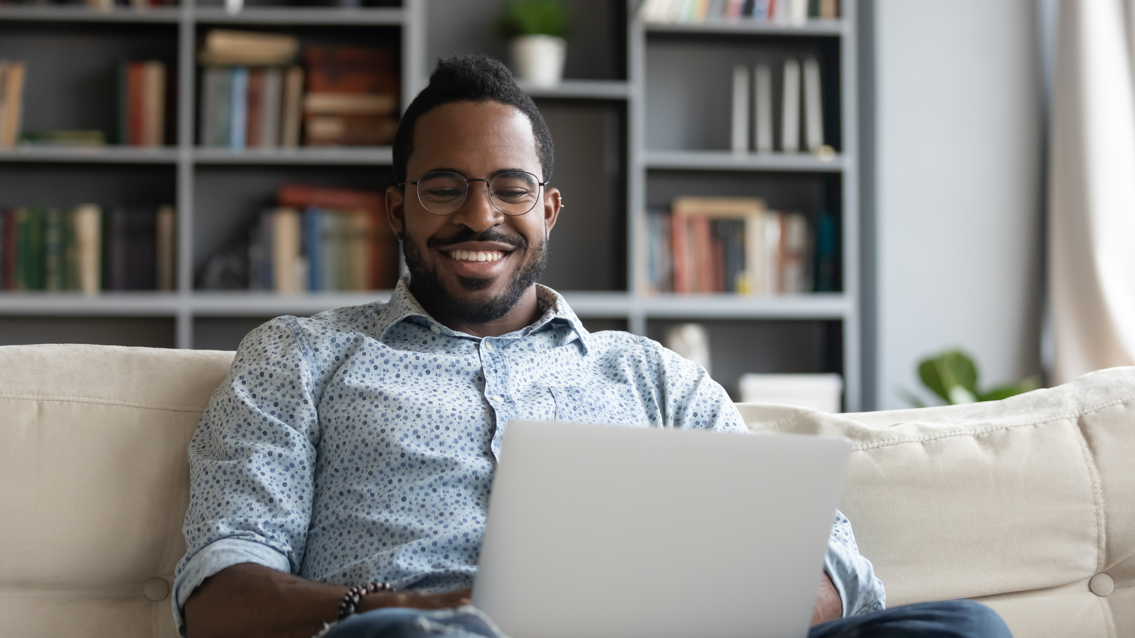 Millennial man engaging with a therapist online.