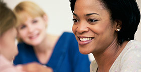 Smiling woman with friends