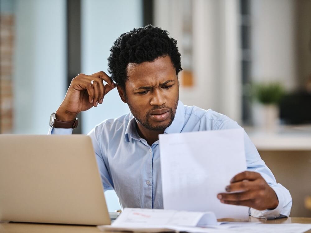 A confused therapist examines his insurance paperwork.