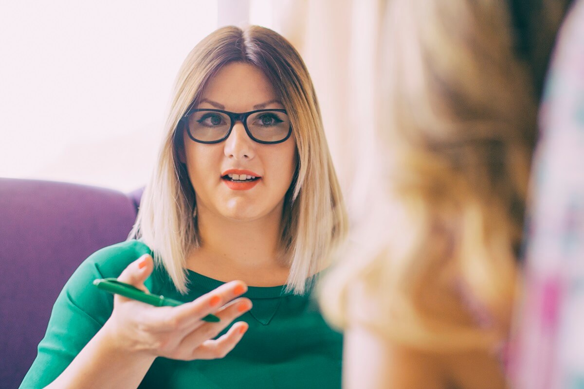 Therapist talking with client