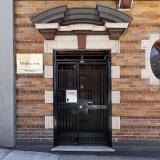 Entrance (enter by using the keypad at the door to the left of the building)