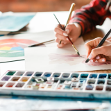 Art therapy provides space to explore feelings, build self-awareness, and develop healthy coping skills through creative expression.