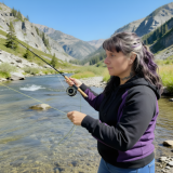 Christine Prebble, LPC fly fishing on a Mountain Stream
