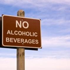 A road sign says, "No alcoholic beverages."