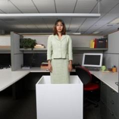 A woman stands in a box.