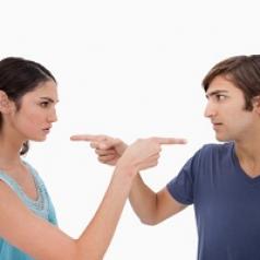 Couple fighting pointing fingers