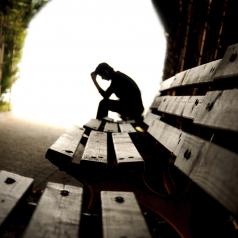 Depressed man on bench