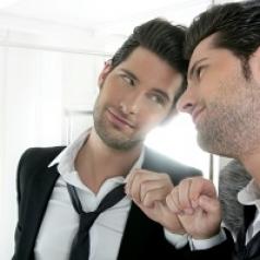 Man admiring himself in mirror