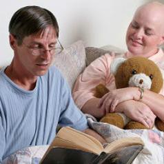 Man reading to cancer patient