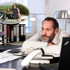 Business man day dreaming about coworker with new car