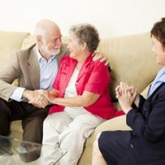 Happy older couple with therapist