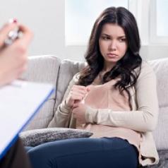 woman in therapy is feeling uneasy