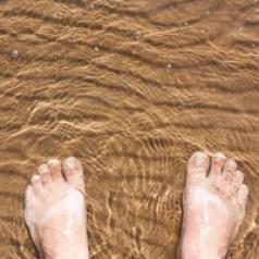 feet-in-water-on-sand