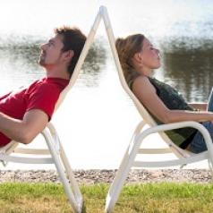 man-and-woman-lounging-with-backs-to-each-other