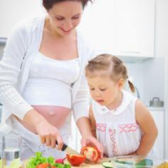 mother-preparing-vegetables-with-child