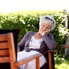 aging woman relaxing on patio