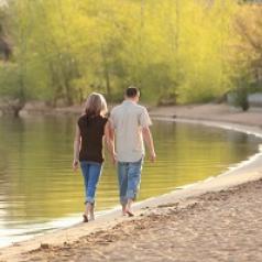 couple walking around lake