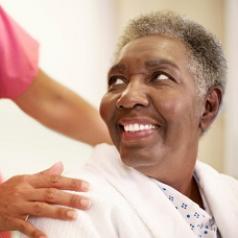 caregiver-touching-elderly-person-122313